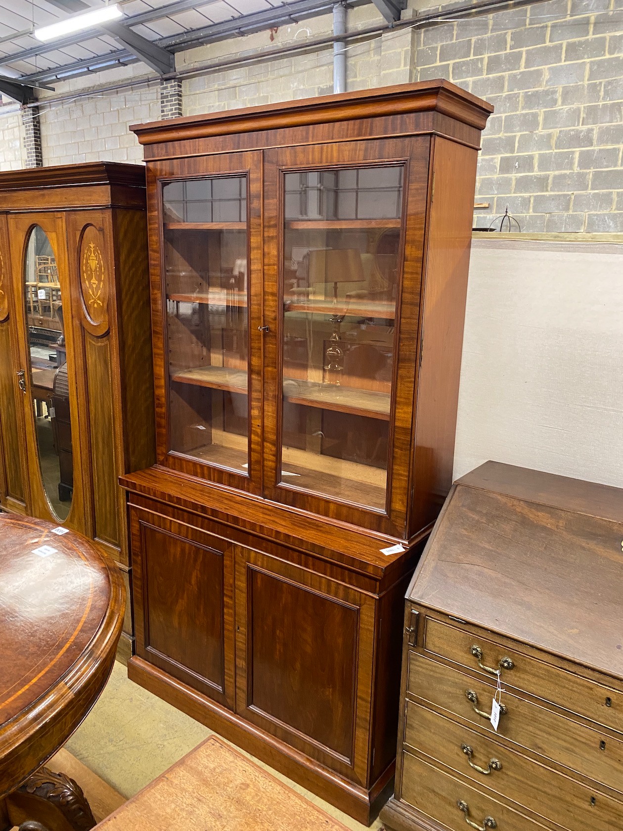 A Victorian mahogany bookcase cupboard width 118cm, depth 49cm, height 217cm.